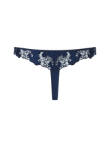 A navy blue Coco de Mer Arella Skirted Thong with delicate blue floral embroidery and scalloped edges.