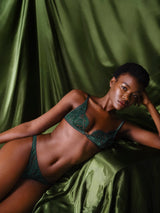 Coco de Mer Isara Open Thong with deep green scalloped lace and two opening panels of rich green silk, paired with Isara Triangle Bra for a luxury set as shown on model.