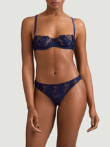 Arella Half Cup Bra and Skirted Thong in delicate blue floral embroidery with scalloped edges, shown on model as the perfect pair