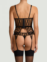 An intricate black French Leaver's lace Basque with luxury velvet binding, an underwired design, and adjustable suspender straps, paired with Kiana Skirted Thong