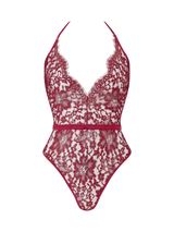 A red lurex Leaver's lace playsuit with a halterneck shape, delicate eyelash trim at the bust, and a silk band at the waist. It includes sleek adjustable silk straps and delicate golden hardware.