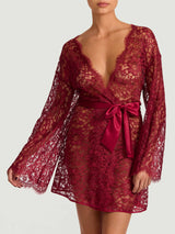 A red lurex Leaver's lace robe with a silk belt, designed with wide sleeves and scalloped edges at the neckline and cuffs., shown on model