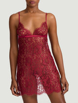 A red lurex Leaver's lace slip with triangle cups, daring leg slit and a keyhole back with a silk covered button as shown on model