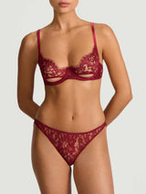 A red lurex Brazilian knicker with intricate Leaver's Lace pattern and scalloped edges.