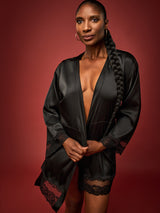 Dame Denise Lewis wears a Coco de Mer Seraphine Robe made of luxurious silk with French Leaver's Lace trims