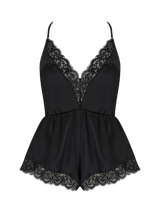 A black silk teddy with corded Leaver's lace trim, featuring a plunging neckline, low V back, and adjustable crossed silk straps. It has a high leg and pleated short design.