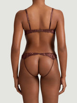Tamia Quarter Cup and Open Knicker set in mocha-colored bespoke embroidery and silk bound strapping, featuring scalloped edges, shown on model