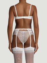 Model wears the ivory balcony bra, suspender belt, ivory scalloped edge with embroidery, ivory silk straps attached to ivory hold-ups