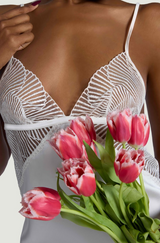 Model wears a UK size M in the Athena Ivory slip with a body and scallop edge detailing with silk straps from the front