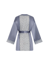 Back view of the Esme Coco de Mer Robe. Made of a powder blue silk with a sheer insert of geometric embroidery at the back and cuff.