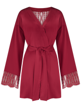 A Red silk robe with red scallop edged French leaver's lace down the centre back and along the cuffs of the sleeve with a red silk tie at the waist.