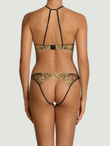 Model wears a UK size M in the black underwire quarter cup bra, shown from the back the gold rose embroidery detailing across the back strap, attaced to black silk straps and paired with the black open knicker showing the gold rose embroidery and exposed bottom, model wears a UK size M