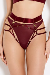 Front image of Model wearing a UK size M in the morello harness brief with high waist strap, shown with mesh knickers underneath, gold attachments connecting to the harness straps over the legs and waist with gold ring detailing centrally on the front