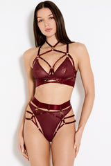 Front image of model wearing a UK size M in the morello multiway bodice bra with mesh cups attached to gold rings across the the front, multiway straps shown with gold sliders across the chest and over the collarbone with a high neck multi straps attached with gold rings, paired with the morello harness briefs