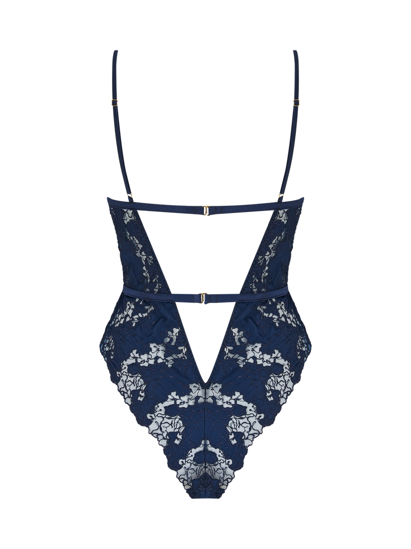 A deep navy blue bodysuit with white floral embroidery, designed with a soft cup shape, silk bands, two adjustable closings at the back and a teardrop cut-out at the chest.
