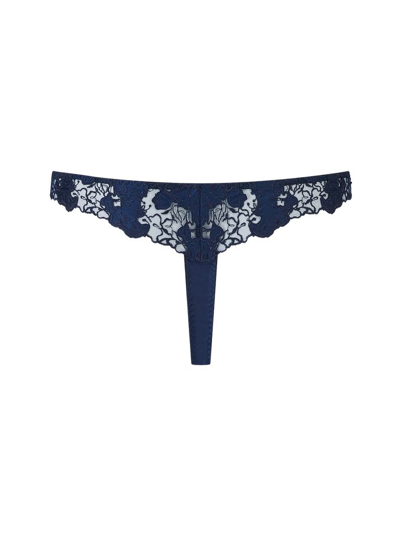 A navy blue Coco de Mer Arella Skirted Thong with delicate blue floral embroidery and scalloped edges.