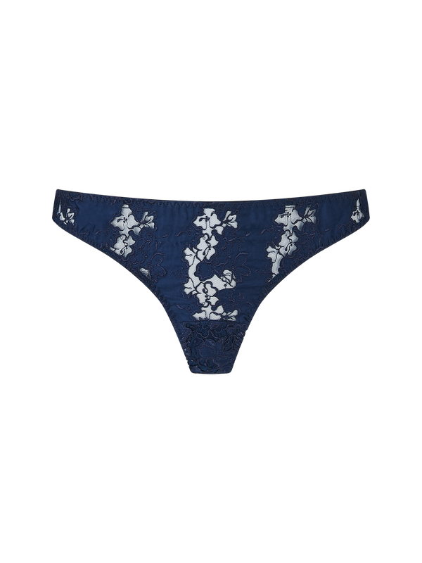 A navy blue Coco de Mer Arella Skirted Thong with delicate blue floral embroidery and scalloped edges.