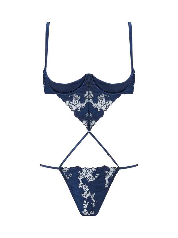 An intricate, navy blue, floral embroidered Coco de Mer Arella Wired Open Playsuit with silk bound crescent cups and adjustable straps.
