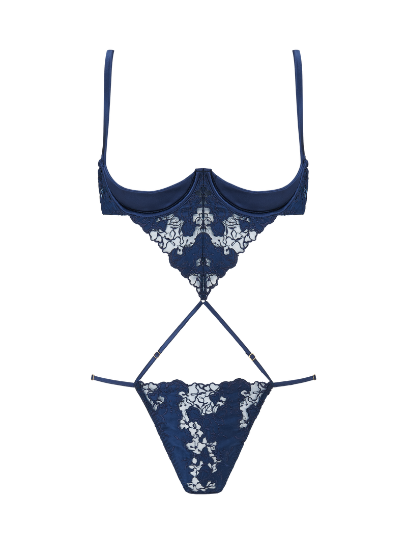 An intricate, navy blue, floral embroidered Coco de Mer Arella Wired Open Playsuit with silk bound crescent cups and adjustable straps.
