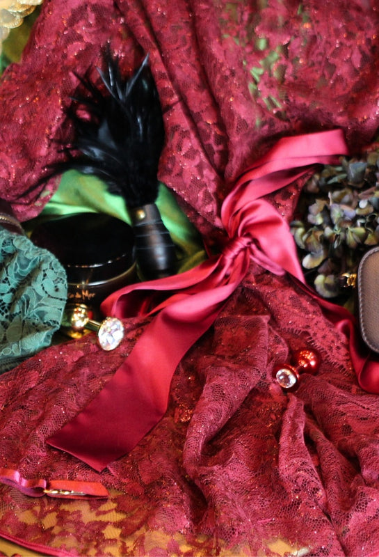 A luxurious selection of treats from Coco de Mer, including Julian Snelling but plugs, a Feather Tickler and a Naraya red lurex lace robe