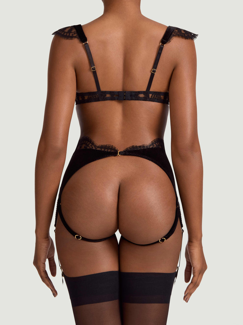 An intricate black French Leaver's lace and luxurious velvet quarter cup bra matched with the open suspender knicker featuring a high waist and adjustable straps