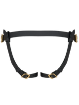 Coco de Mer's sturdy leather strap on harness, secured with gleaming brass hardware