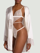 Model wears the ivory silk robe with scallop edge detailing paired with the athena ivory playsuit in UK size S/M