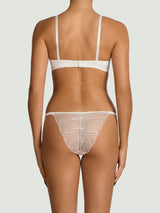 Model wears a UK size 34B Athena ivory balcony bra paired with the athena ivory brazilian knickers in a UK size M from the back 
