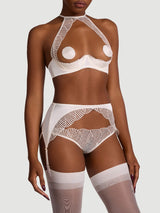 Model wears a UK size S/M in the ivory open suspender knickers with an embroidered scallop edge with ivory quarter cup bra scallop edge embroidery, ivory hold ups attached by silk straps