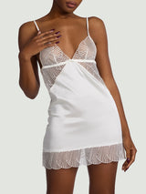 Model wears an ivory silk slip with sheer scallop edge embroidery over the chest and scallop edge embroidery bottom edge detailing 
