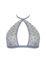 Front view of the Coco de Mer Esme soft cup halter neck bra in powder blue. Features geometric floral embroidery on the bust, with silk binding and a cut out in the middle. 