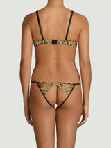 Model wears a UK size M in the black underwire playsuit showing the gold rose embroidery detailing along the back with the exposed bottom and lace straps 