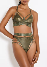 Model wears a UK size M in the Olive multiway bodice, with mesh cups underneath adjustable harness straps, gold sliders across each strap going above the chest and following up to the neck, paired with the Olive harness brief from the front