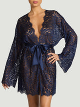 Model wears sapphire scallop edge lace robe with silk tie across the waist 