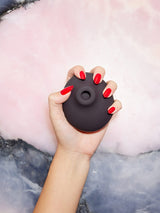In the palm of a hand, the Luxury clitoral suction toy, The Stimulator, fits perfectly